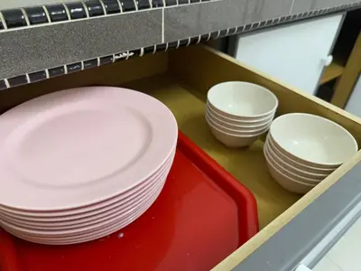 a tray with plates and bowls in a drawer at Austin Taman Daya Large Corner House for 10 Pax in Gua Sai