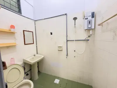 a bathroom with a toilet and a sink and a shower at Austin Taman Daya Large Corner House for 10 Pax in Gua Sai