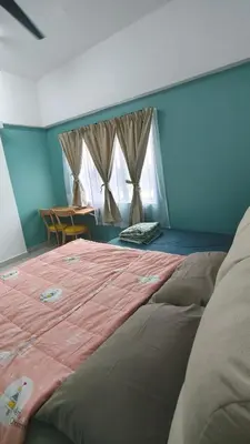 a large bed in a room with two windows at Hygge Living Kampar III Near UTAR in Kampar