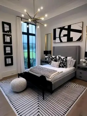 a bedroom with a large bed and a large window at Brian's Estate in Tanah Rata