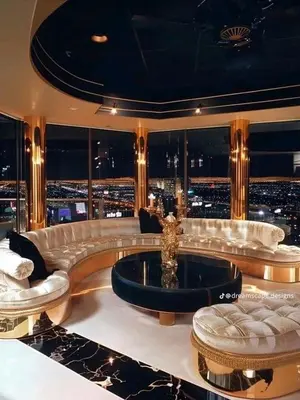a large living room with a tub with a view of a city at Brian's Estate in Tanah Rata