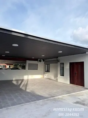 a large building with a large parking lot at Stylish Landed Stay in Kulim