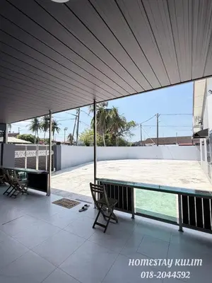 a view of a swimming pool from the roof of a house at Stylish Landed Stay in Kulim