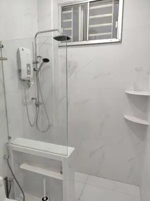 a shower with a glass door in a bathroom at Jed Lifestyle Studio in Kepala Batas