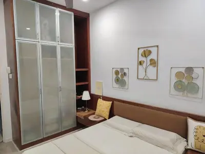 a bedroom with a bed and a glass cabinet at Jed Lifestyle Studio in Kepala Batas