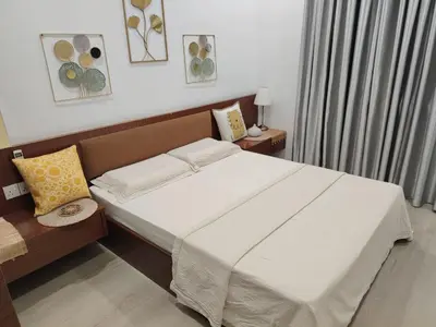a bedroom with a large bed with white sheets and pillows at Jed Lifestyle Studio in Kepala Batas