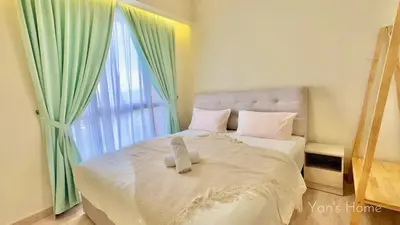 a white bed with a teddy bear sitting on it at The Minty Nest - Piccadilly Residence Ipoh with Infinity Pool in Ipoh