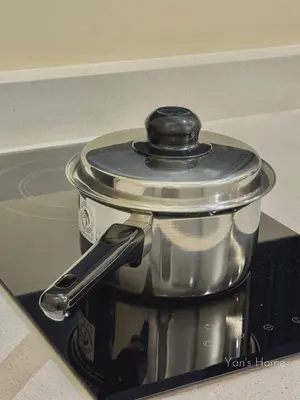 a pot sitting on top of a stove at The Minty Nest - Piccadilly Residence Ipoh with Infinity Pool in Ipoh