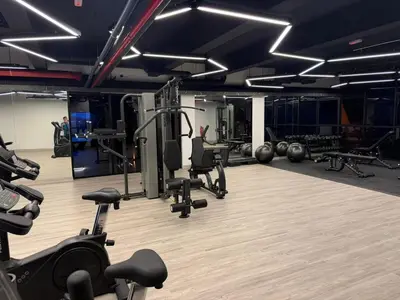 a gym with several treadmills and weights at The Minty Nest - Piccadilly Residence Ipoh with Infinity Pool in Ipoh
