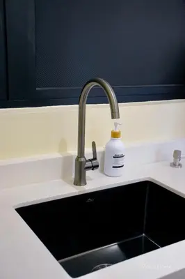 a kitchen sink with a soap bottle next to it at The Minty Nest - Piccadilly Residence Ipoh with Infinity Pool in Ipoh
