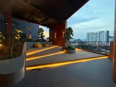a balcony with lights on the side of a building at The Minty Nest - Piccadilly Residence Ipoh with Infinity Pool in Ipoh