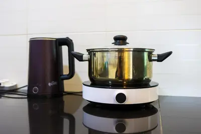 a pot sitting on top of a stove at 32 cozy stay Projector, Karaoke , BBQ, 7 carpark in Ipoh