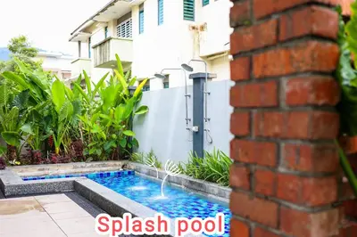 a swimming pool in the backyard of a house at 32 cozy stay Projector, Karaoke , BBQ, 7 carpark in Ipoh