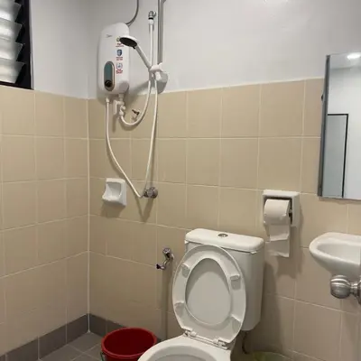 a bathroom with a toilet and a shower at pangkor ocean lot10 in Pangkor