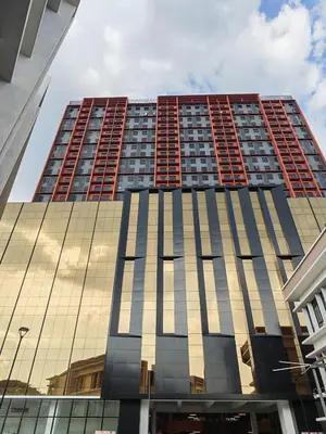 a tall building with a lot of windows at IPOH Piccadilly Cozy unit with City View in Ipoh