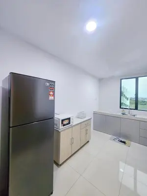 a kitchen with a stainless steel refrigerator in a room at Ipoh Manhattan Condo, Pengkalan 4br12pax in Ipoh