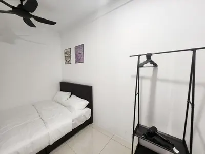 a white room with a bed and a ceiling fan at Ipoh Manhattan Condo, Pengkalan 4br12pax in Ipoh