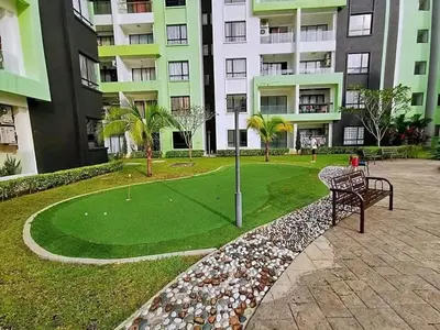 a golf course in front of a apartment building at Ipoh Manhattan Condo, Pengkalan 4br12pax in Ipoh