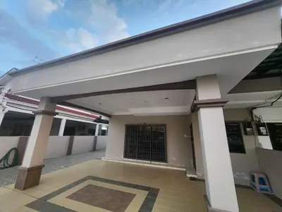 a front view of a building with a garage at Ipoh sunway lostworld 5br 15pax in Tambun