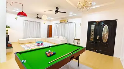 a living room with a pool table in it at IPOH PRIVATE POOL VILLA 6BR 23pax in Ipoh