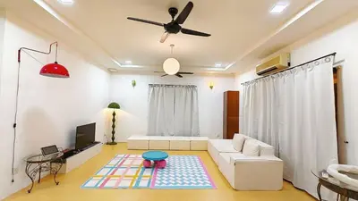 a living room with a couch and a ceiling fan at IPOH PRIVATE POOL VILLA 6BR 23pax in Ipoh