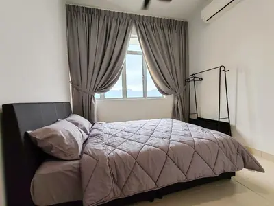 a bedroom with a bed in front of a window at BW Urban Stay in Ipoh