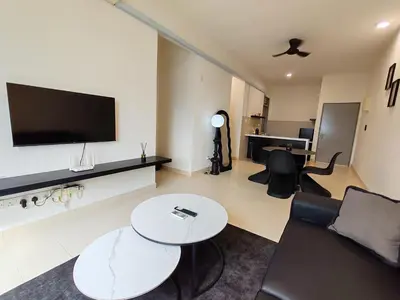 a living room with a couch and a table and a television at BW Urban Stay in Ipoh