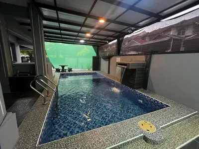 a jacuzzi tub in a room with a view at Teratak Minda Cerdas in Kulim