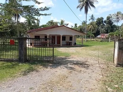 a small house with a gate in front of it at HaniHomestay4U in Kuala Lipis