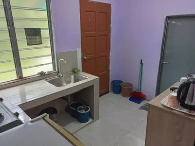 a kitchen under construction with a sink and a door at HaniHomestay4U in Kuala Lipis