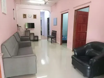 a living room with two couches and a television at HaniHomestay4U in Kuala Lipis