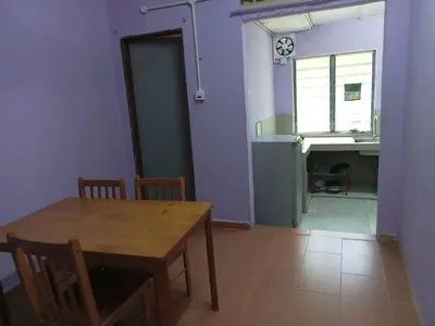 a dining room with a table and a sink at HaniHomestay4U in Kuala Lipis
