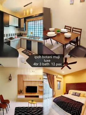 a kitchen and a living room with a table at ipoh botani 4br12pax pets friendly muji luxe in Ipoh
