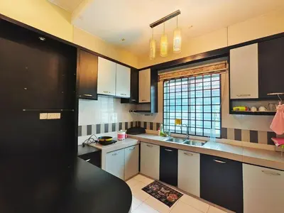 a kitchen with white and black cabinets and a window at ipoh botani 4br12pax pets friendly muji luxe in Ipoh
