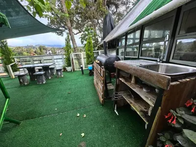 a backyard with a sink and green grass at Mountain View Sameer Glamping in Cameron Highlands