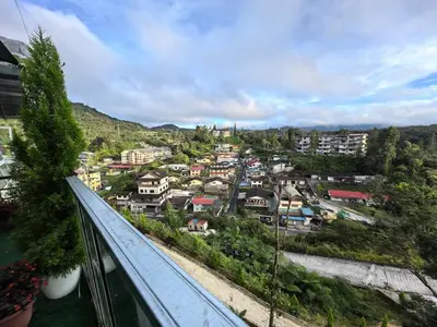 a view of a city from a balcony at Mountain View Sameer Glamping in Cameron Highlands