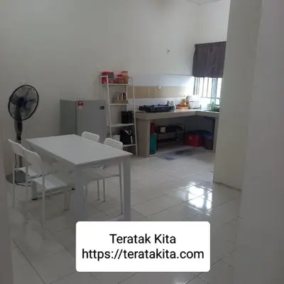 a kitchen with a white table and chairs in a room at Homestay Teratak Kita in Behrang Hulu