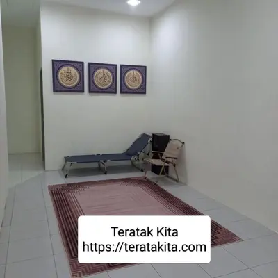 a room with a bench and a table and a rug at Homestay Teratak Kita in Behrang Hulu