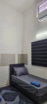 a bed in a room with a window and a bed sidx sidx sidx at Teluk Intan Bajet Homestay Landed 3Bedrooms in Teluk Intan