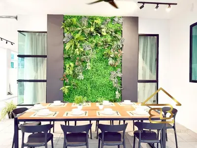 a table with chairs and a green wall at Ipoh Fairy Villa 3 Pool, Jacuzzi & KTV 23 Pax in Ipoh