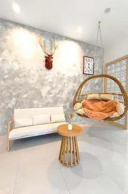 a living room with a couch and a hanging bed at Deer Farm Pool Villa 5BR 27pax by One Life Four Season Guesthouse in Tanjung Rambutan