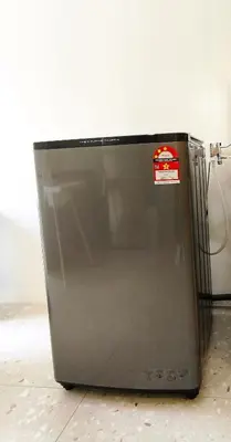 a refrigerator with a sticker on it sitting on the floor at Deer Farm Pool Villa 5BR 27pax by One Life Four Season Guesthouse in Tanjung Rambutan
