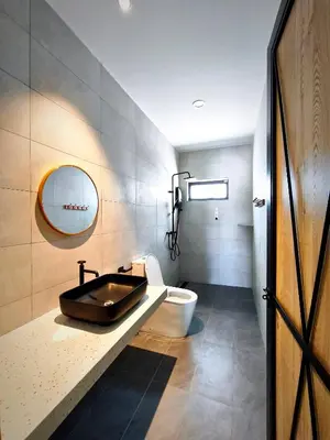 a bathroom with a sink and a toilet at Deer Farm Pool Villa 5BR 27pax by One Life Four Season Guesthouse in Tanjung Rambutan