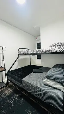 a bedroom with a bunk bed in a room at D'Zebra Homestay Tambun in Kampong Batu Lapan
