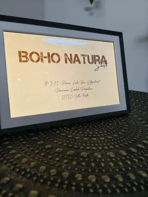 a framed picture of a sign for a restaurant at Tambun Apartment - Boho Natura in Tambun