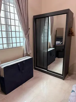 a large mirror in a room with a dresser at PRS Bungalow Homestay in Ipoh