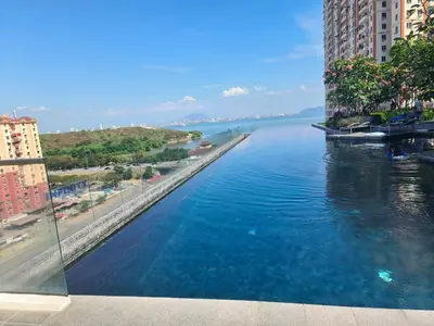 a view of a river between two tall buildings at Urban Suites, Penang in George Town
