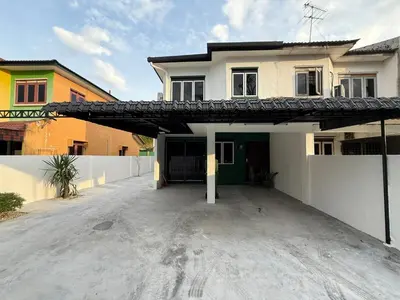 an empty parking lot in front of a house at Green Living Homestay Bercham 8 Pax in Ipoh