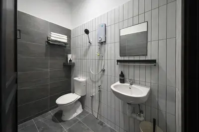 a bathroom with a toilet and a sink at The Cintra Muse Hotel at Central of Georgetown and UNESCO in George Town