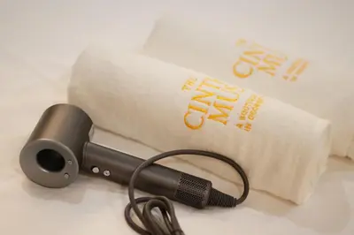 a blow dryer next to a roll of toilet paper at The Cintra Muse Hotel at Central of Georgetown and UNESCO in George Town